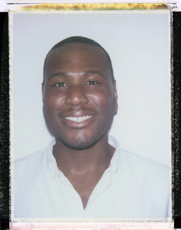 That Good Co A man with short hair and a trimmed beard smiles at the camera, wearing a light-colored collared shirt against a plain white background.